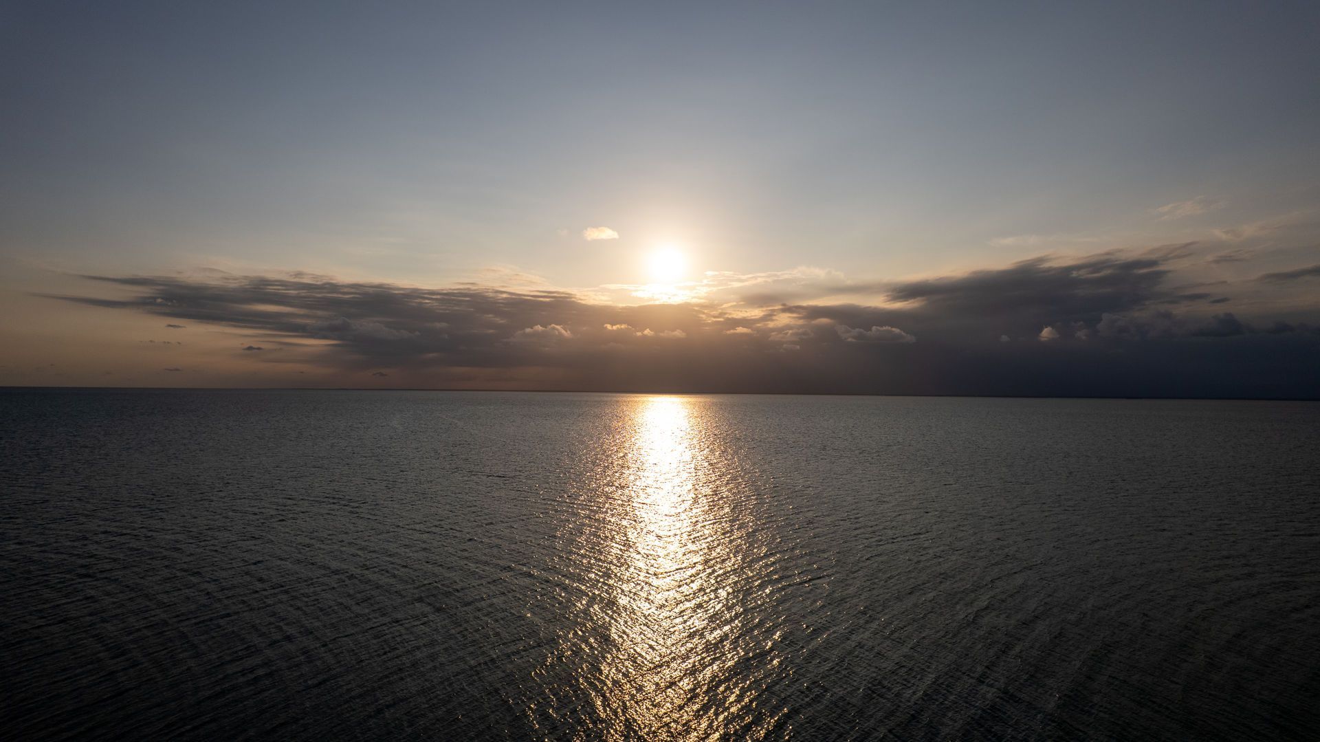 Two people snorkeling in clear turquoise water.