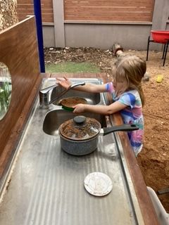 A Child Playing In the Gardenβ Gap Community Early Learning Centre In The Gap, NT