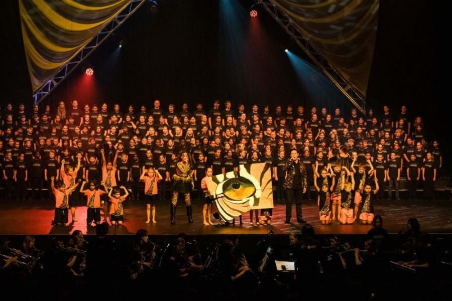 A large group of people are standing on a stage.