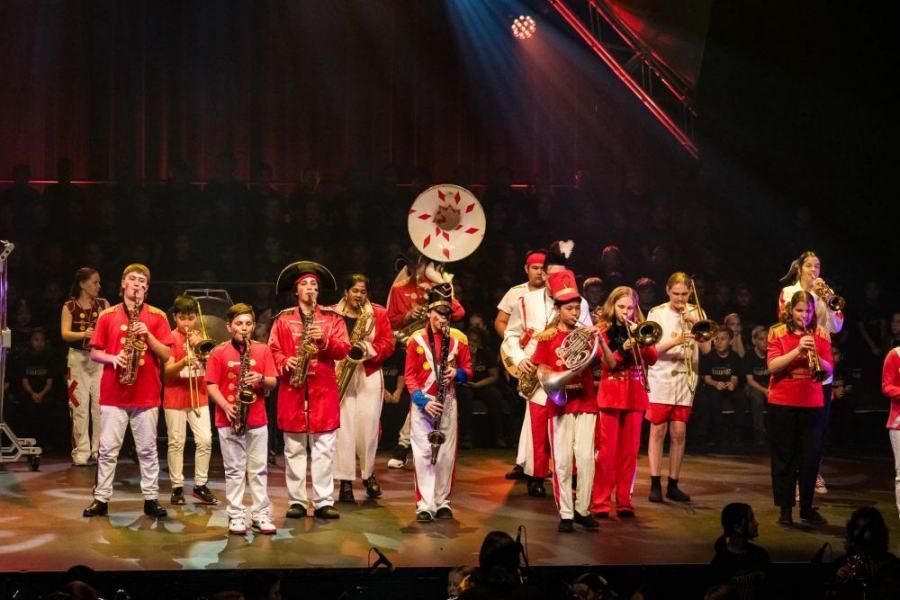A group of people are playing instruments on a stage.