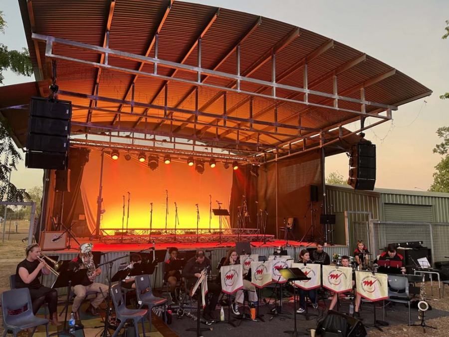 A group of people are playing instruments on a stage.