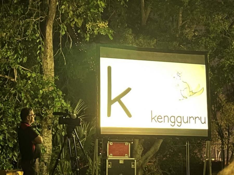 A large screen with the letter k on it
