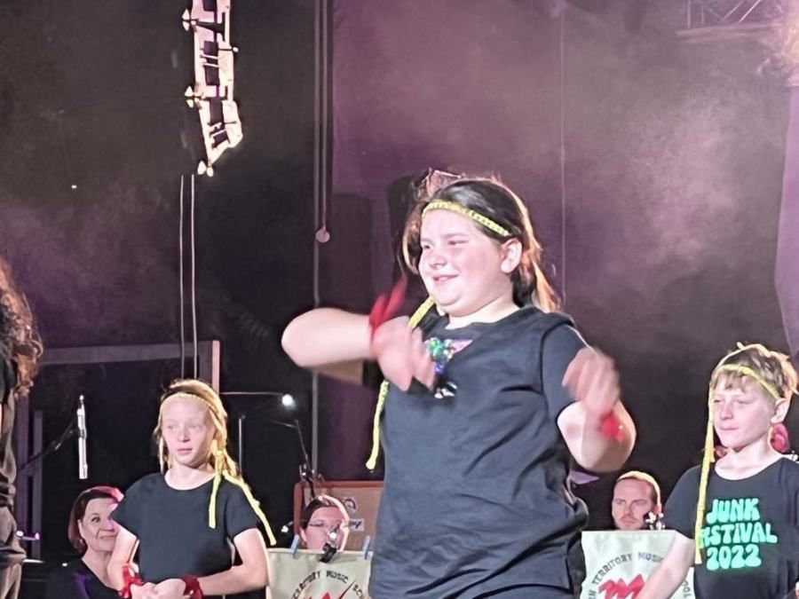 A girl in a black shirt that says junk festival 2022