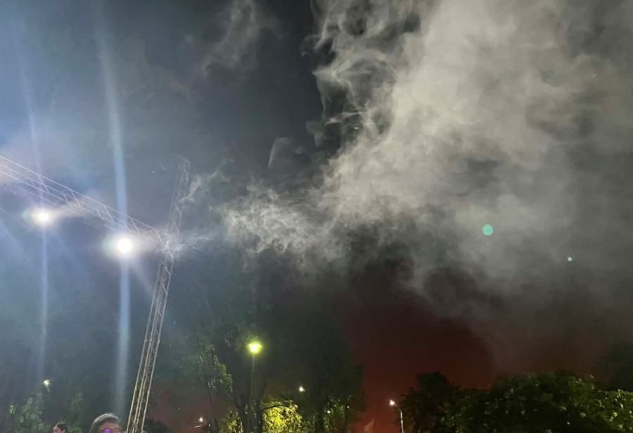 There is a lot of smoke coming out of the sky at night.