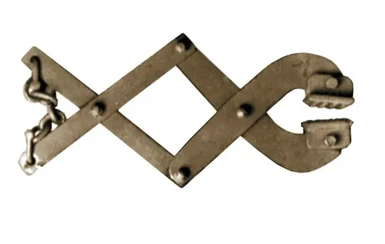 Metal tire chain tool with hinged scissor-like handles and jaws with gripping teeth, attached to a chain.