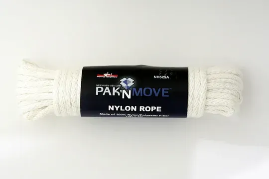 Coil of white PAK'N MOVE nylon rope with a dark blue label against a white background.