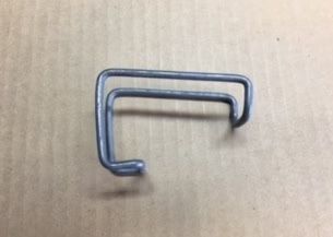 Bent metal clip, gray in color, with a hooked end and two parallel rectangular sections.