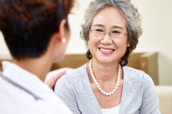 Ligation — Senior Woman Talking To Family Doctor in Manchester, NH