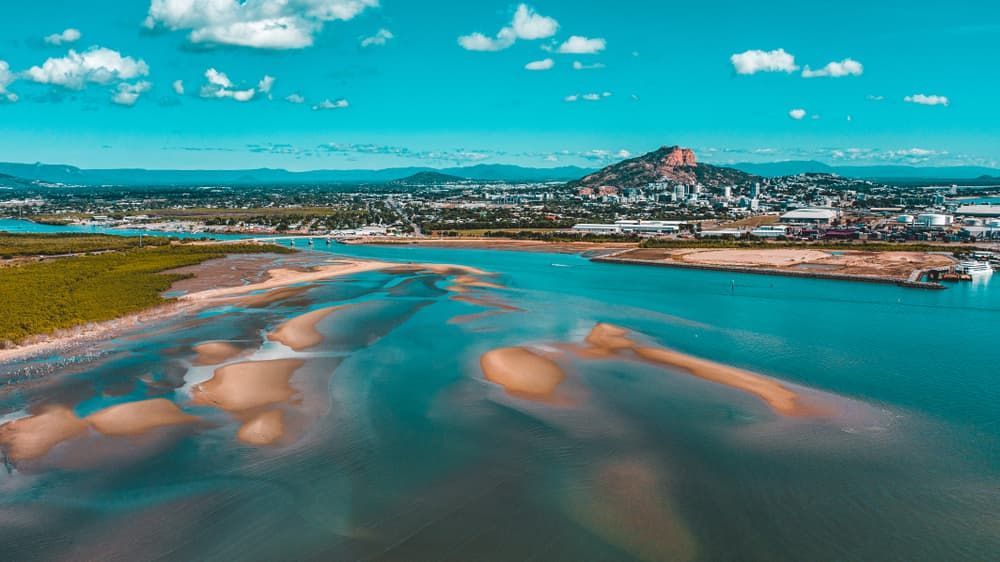 An Aerial View of A Body of Water with A City in The Background — New Park Suit Hire & Menswear in Townsville, QLD