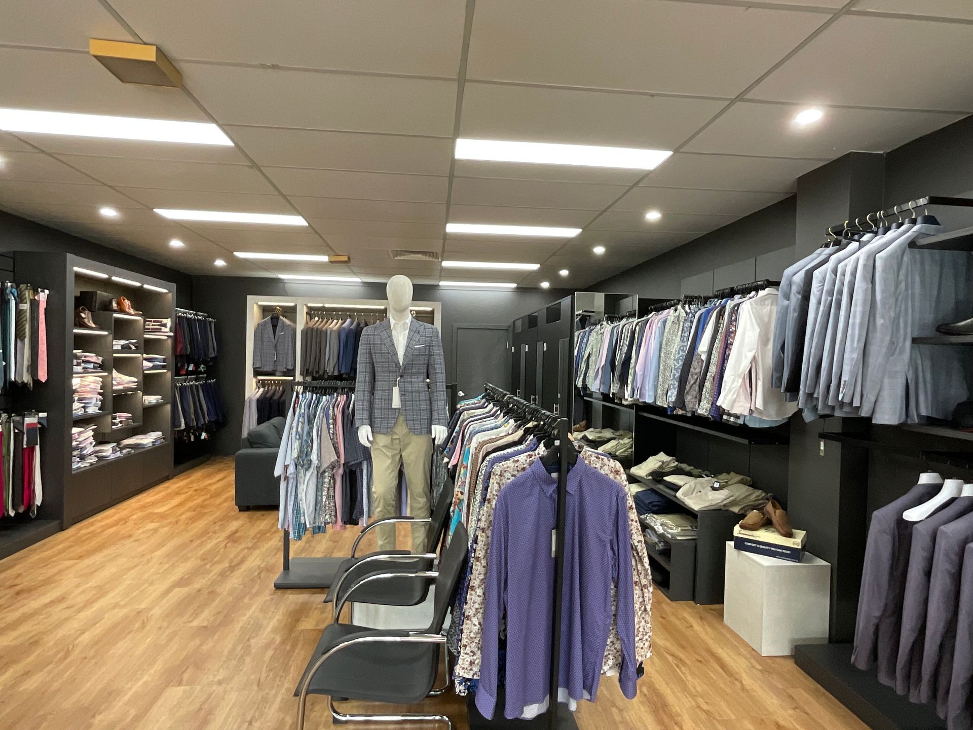 A Display of Suit Jackets for Every Occasion with Mannequin — New Park Suit Hire & Menswear in Hermit Park, QLD
