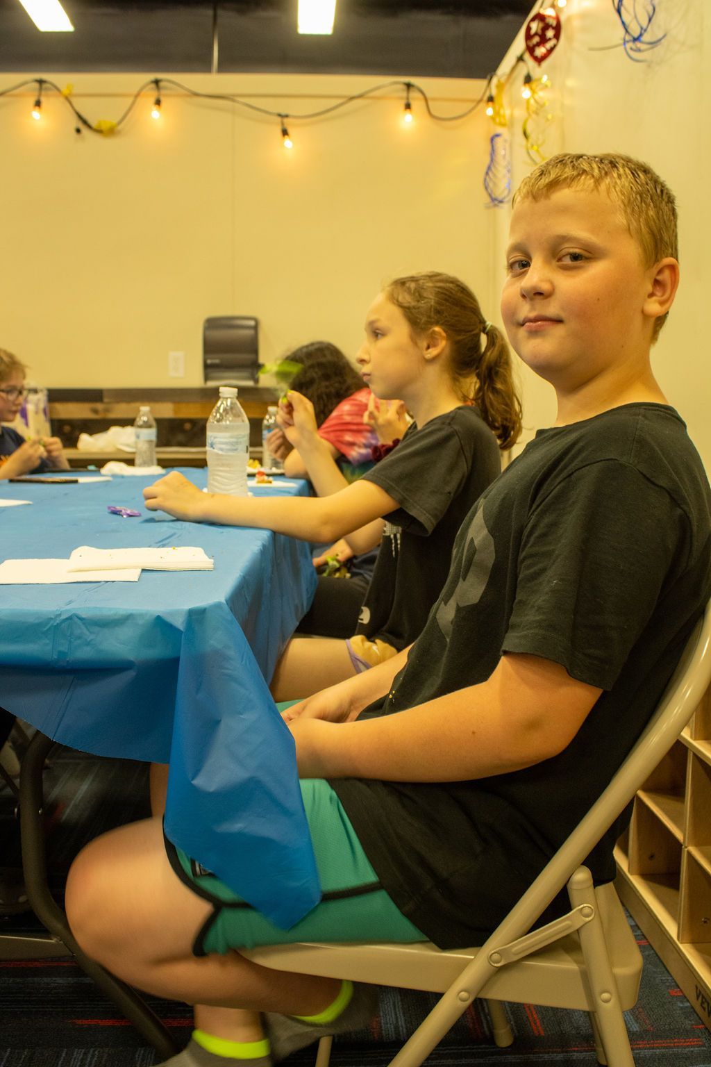 kids at a table for a birthday party at Impact Fun Zone