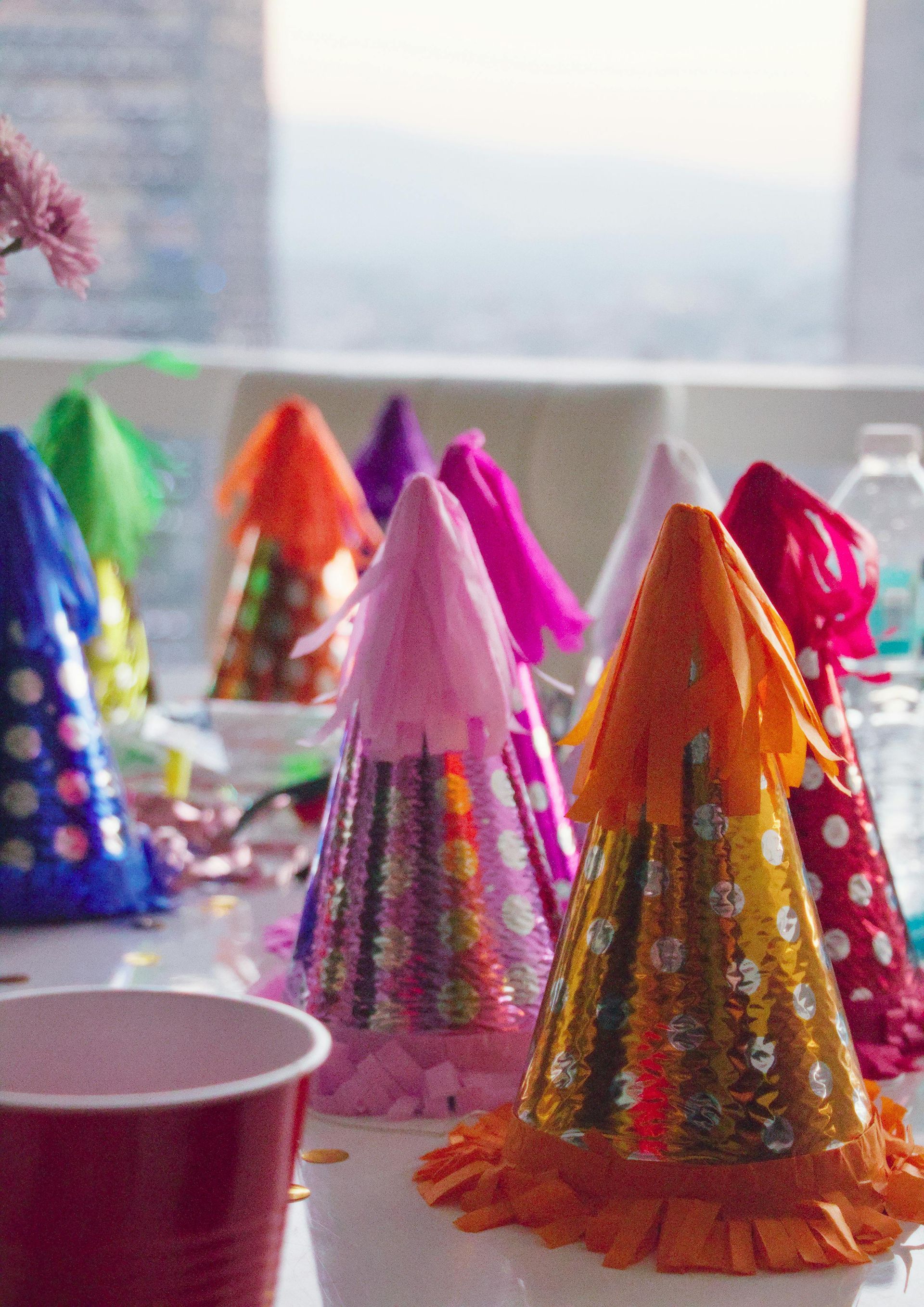 A bunch of party hats are sitting on a table