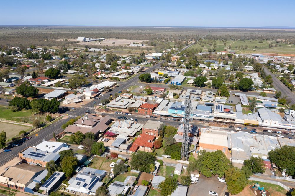 An Aerial View of a Small Town With Lots of Buildings and Trees — Hume Plumbing & Roofing Wollongong in Dapto, NSW