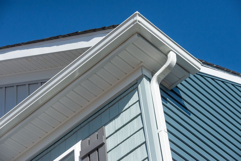 A Close Up of the Roof of a House With a White Gutter — Hume Plumbing & Roofing Wollongong in Kiama NSW