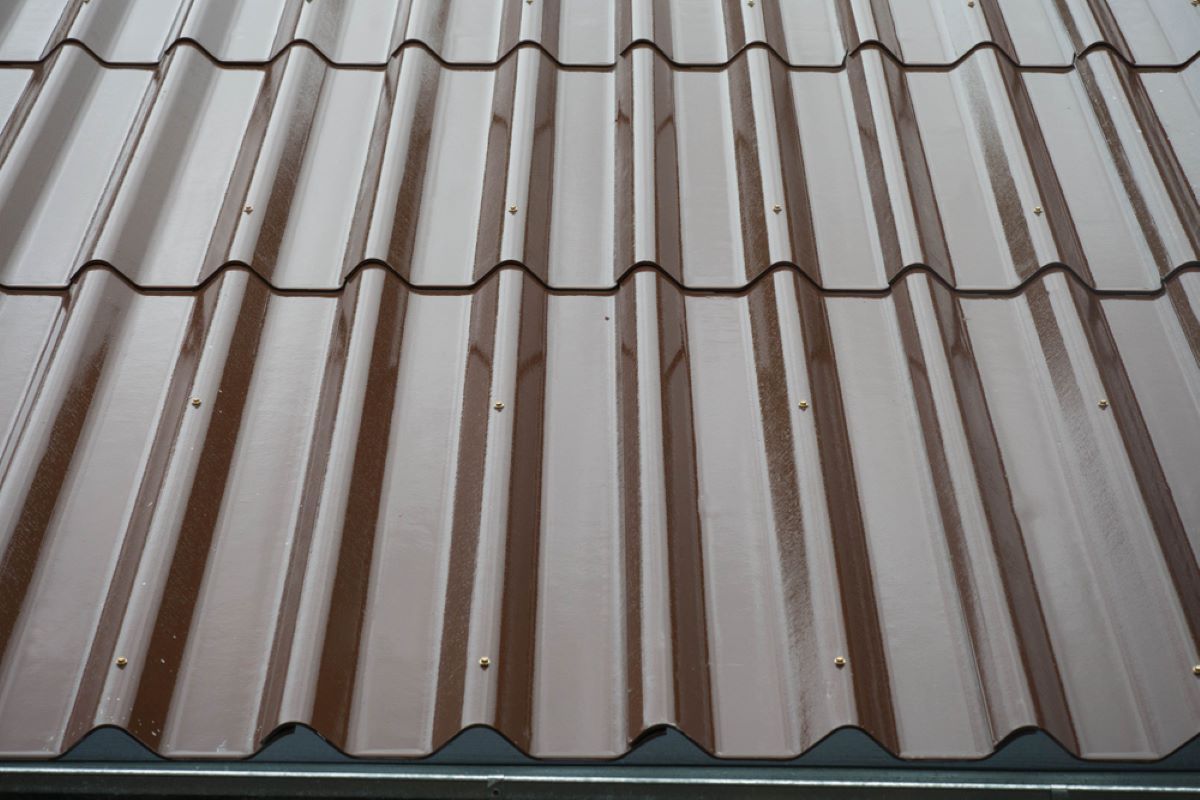 A Close Up of a Brown Corrugated Metal Roof — Hume Plumbing & Roofing Wollongong in Shellharbour, NSW