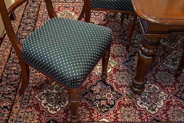 upholstered chair on carpet