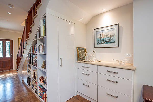 drawers with framed painting above them