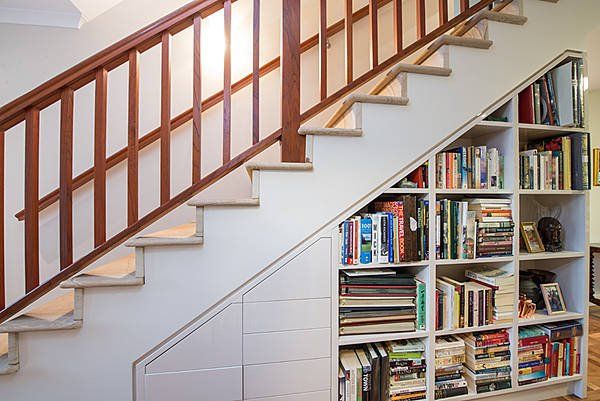 staircase with bookcase underneath