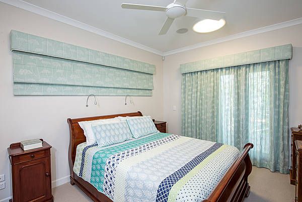 bedroom with aqua window treatments