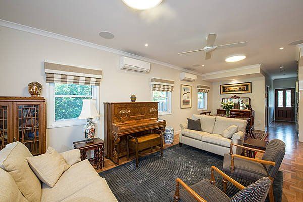 living room with white sofas