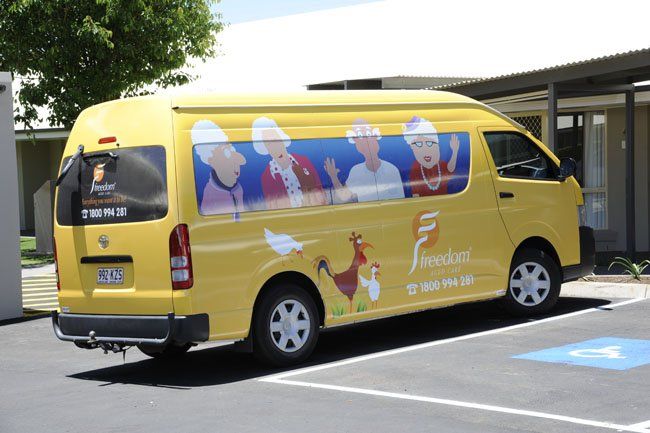 yellow van parked outside building