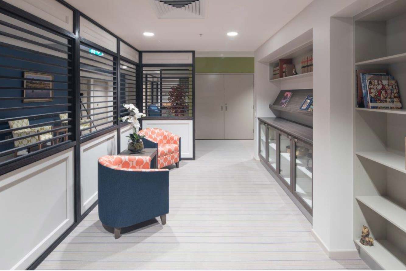 living room with two orange and blue chairs
