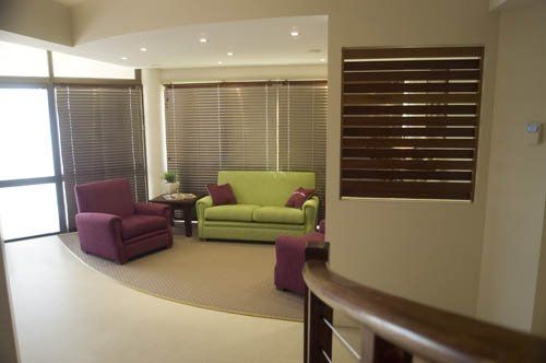 lobby with green and purple sofas