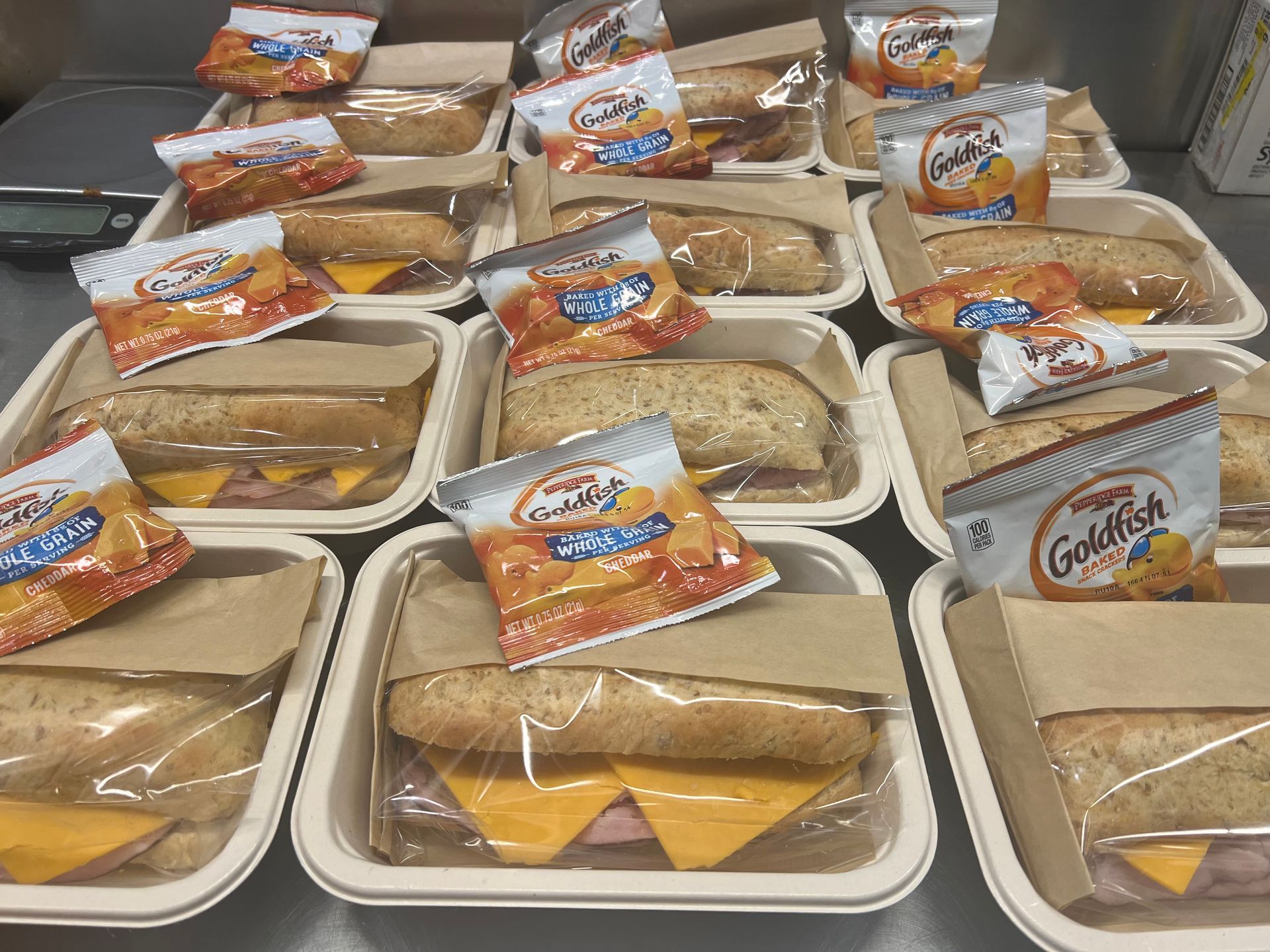 Prepared lunch trays with sandwiches and Goldfish crackers.