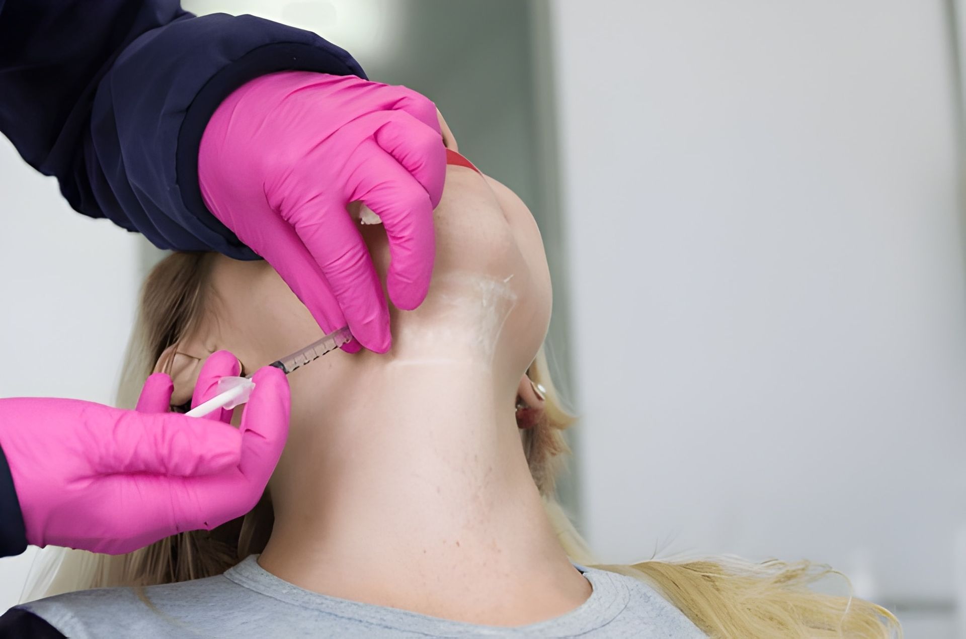 Person Receiving Injection in Their Neck — Bespoke Longevity and Aesthetic Medicine In Southport, QLD