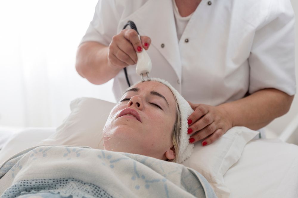 Woman Receiving Facial Treatment — Bespoke Longevity and Aesthetic Medicine In Southport, QLD