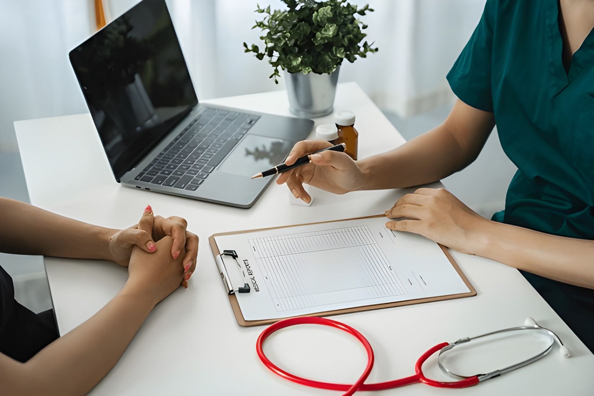 Doctor Consulting With a Patient on the Table — Bespoke Longevity and Aesthetic Medicine In Southport, QLD
