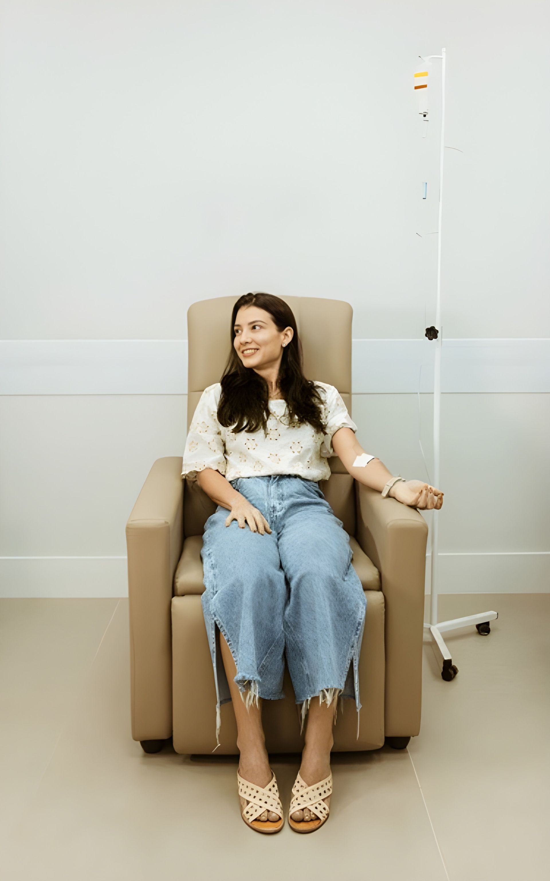 Woman in Chair is Doing a Nad Therapy — Bespoke Longevity and Aesthetic Medicine In Southport, QLD
