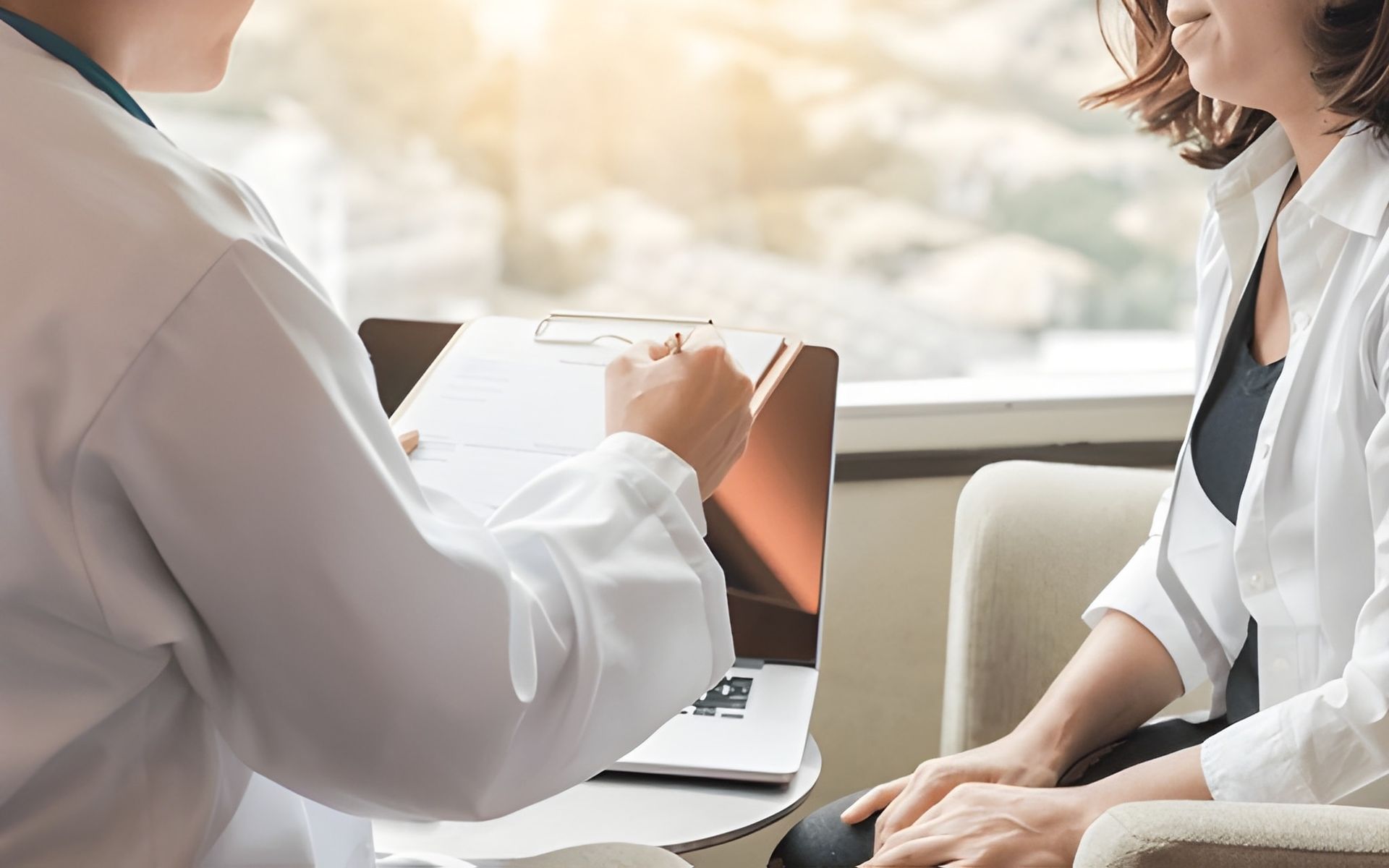 Doctor in White Coat Showing Paperwork to a Seated Patient — Bespoke Longevity and Aesthetic Medicine In Southport, QLD