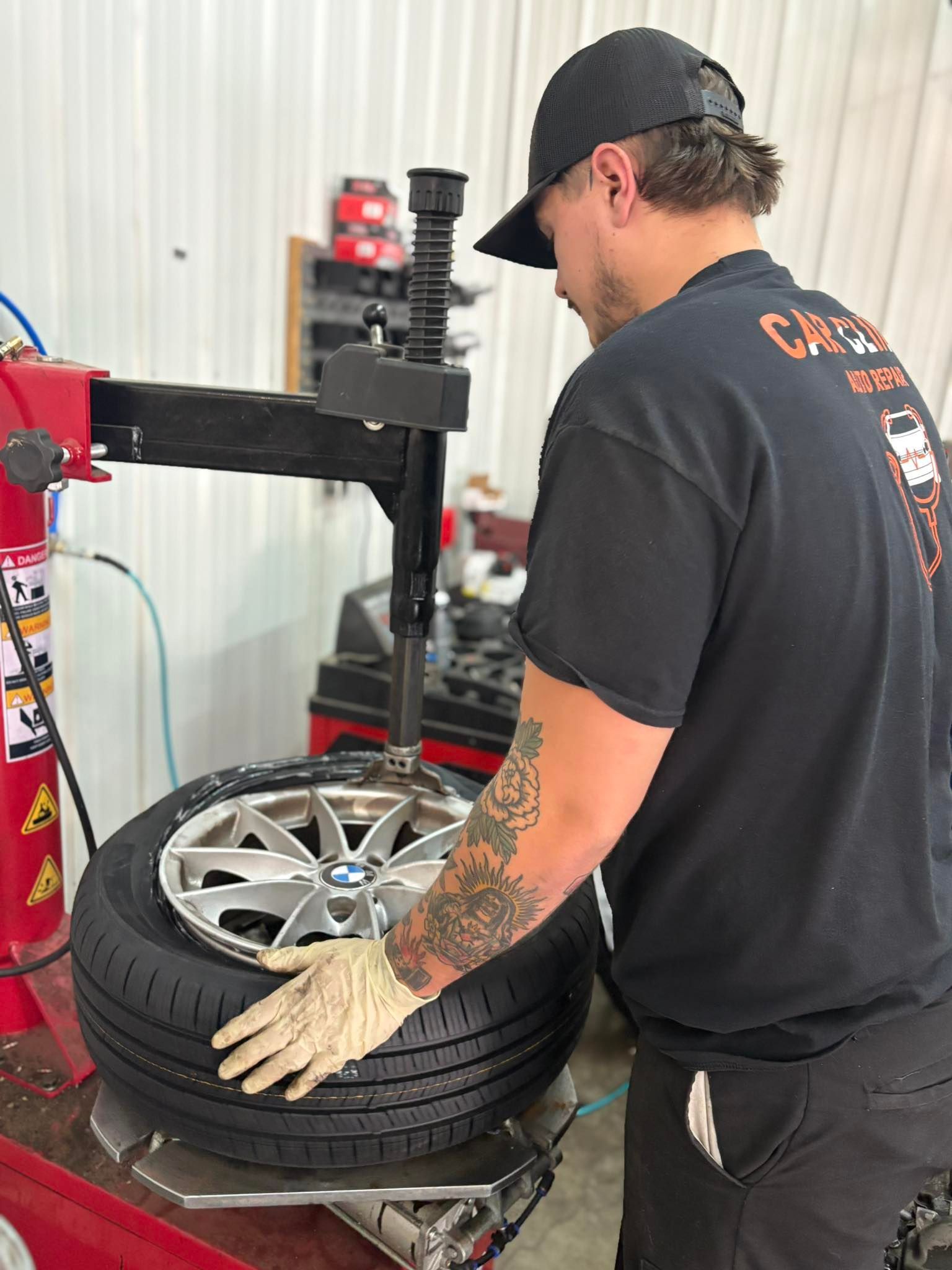 Mechanic Changing a Tire in a Shop | Car Clinic