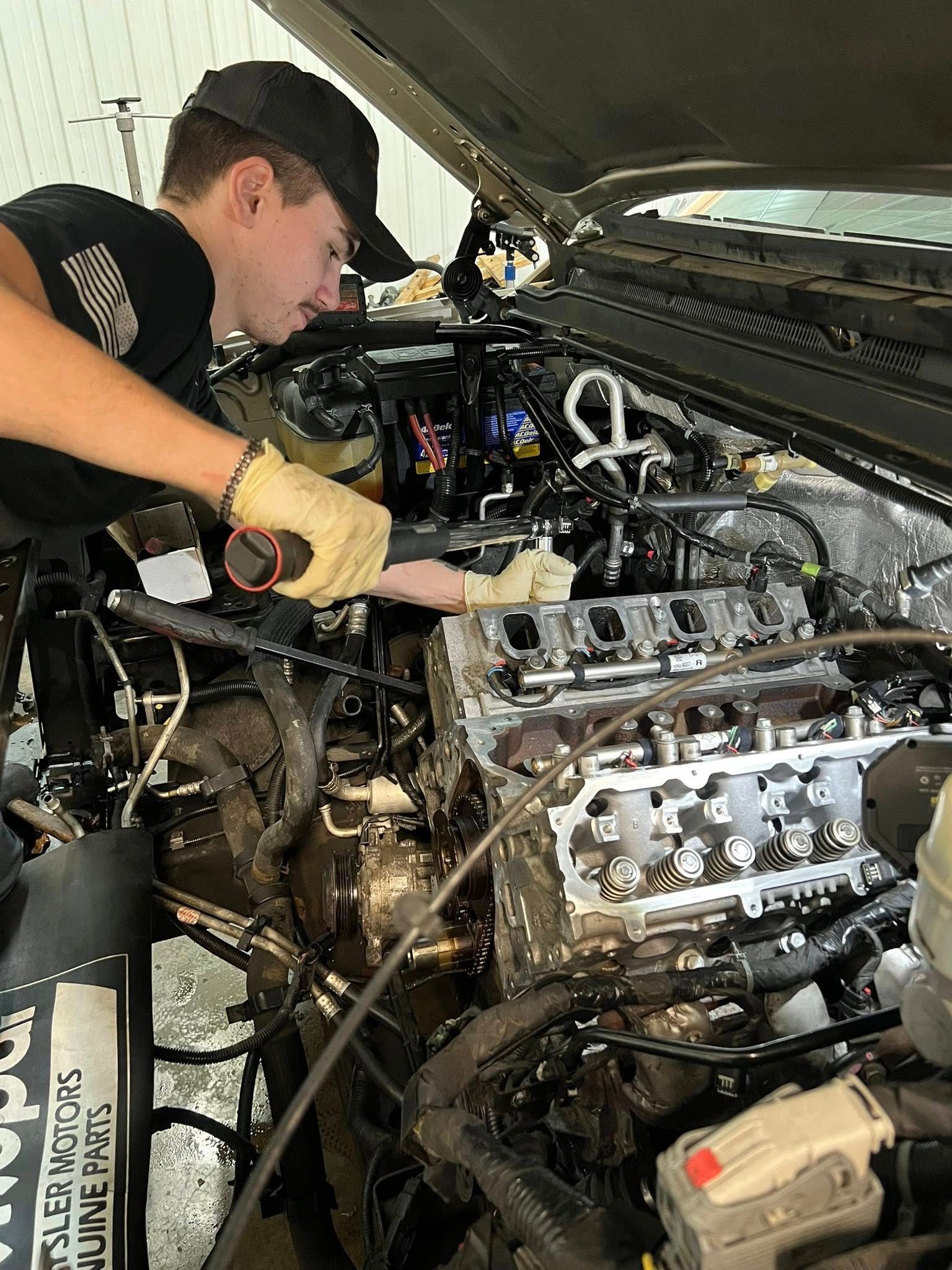 Mechanic Working on a Car Engine | Car Clinic