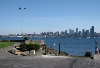 A city skyline is visible over a body of water