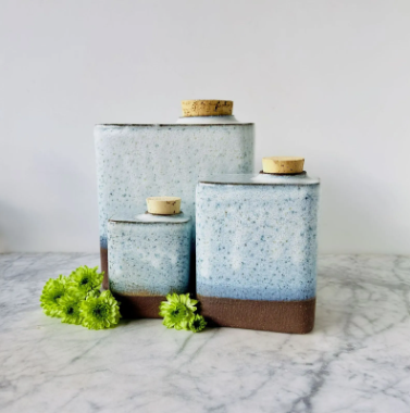 A striped silver urn, miniature brass striped urn, and blue floral urn
