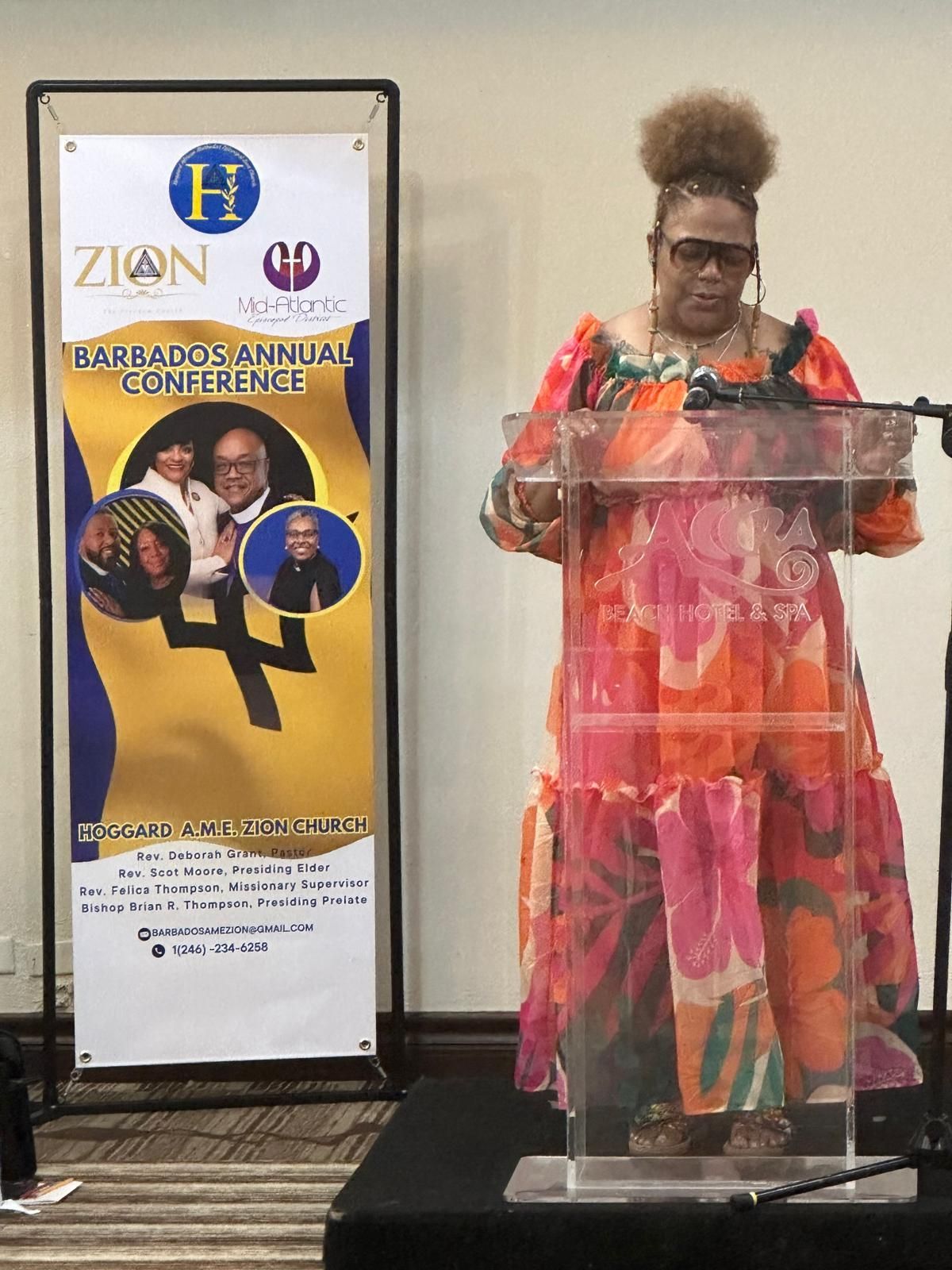 A woman is standing at a podium giving a speech.