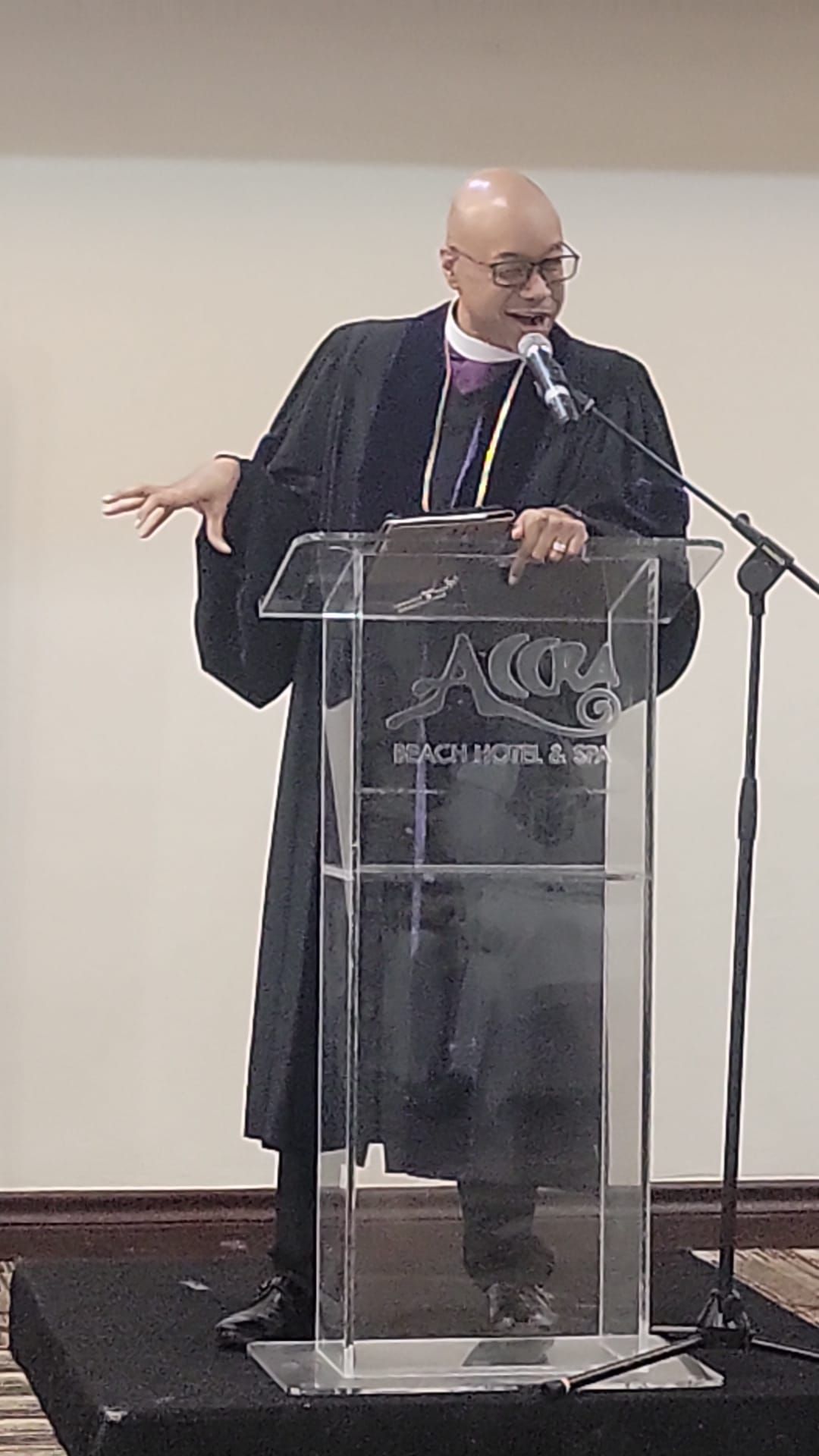 A man is standing at a podium giving a speech.