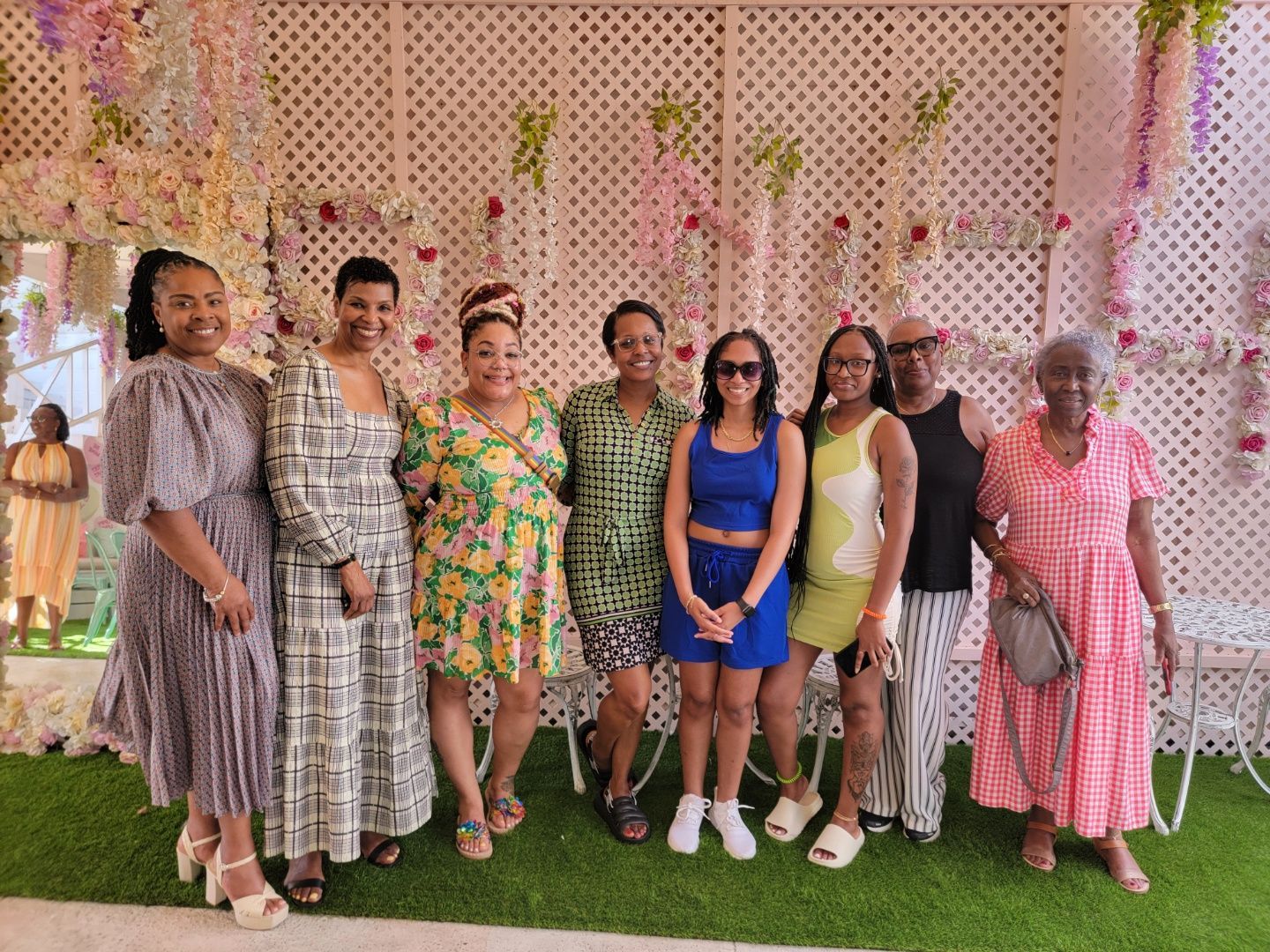 A group of women are posing for a picture together.