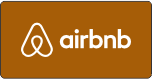The airbnb logo is on a brown background.
