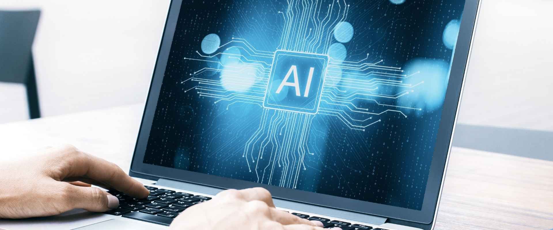 Hands typing on a laptop with an 