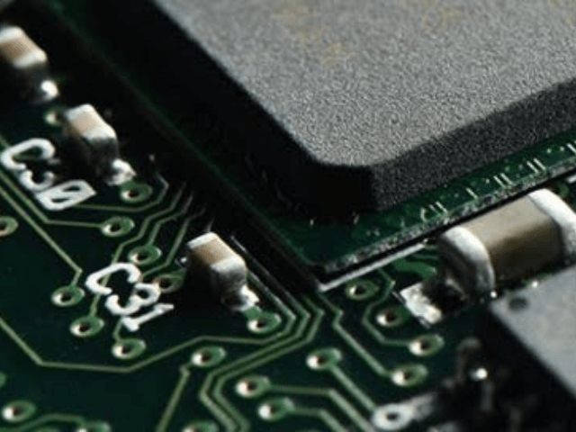 A close up of a circuit board with the number c33 on it