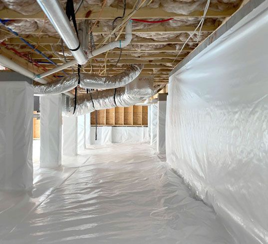 Crawl space: white vapor barrier on floor and walls, pipes, ductwork, and support posts visible.