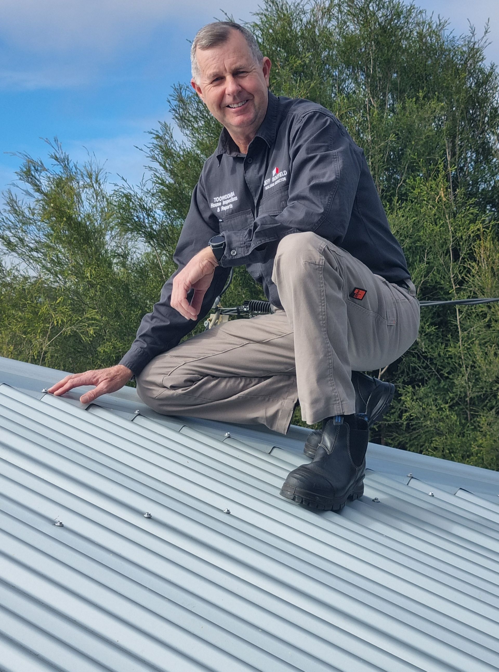 man looking at roof