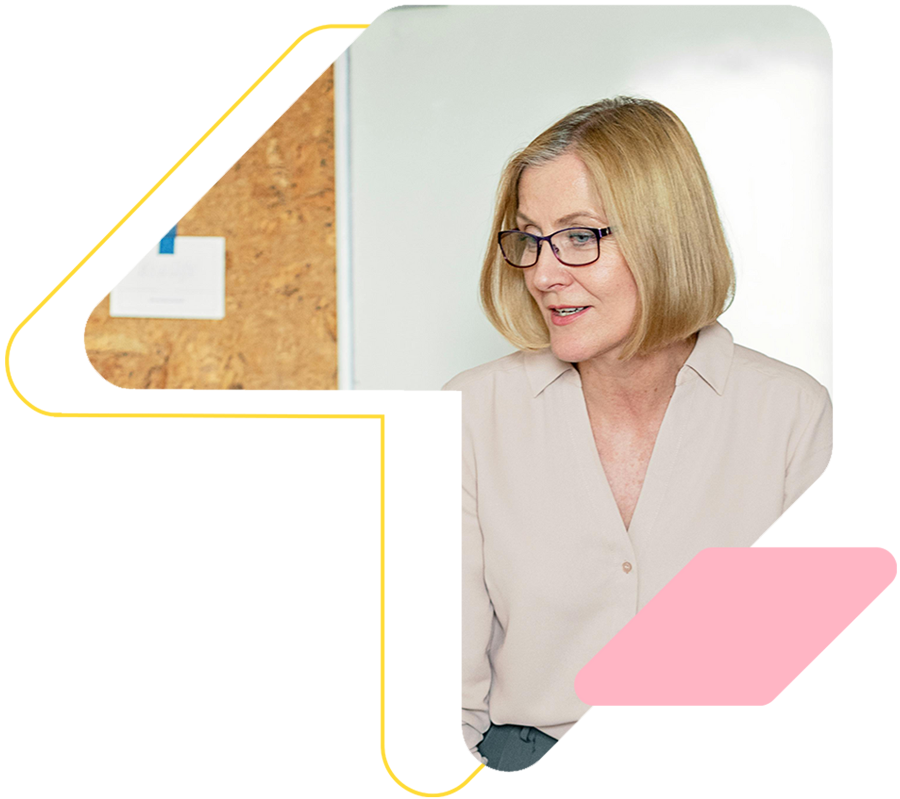 A woman wearing glasses is sitting in front of a white board.