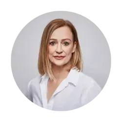 A woman in a white shirt is standing in a circle.