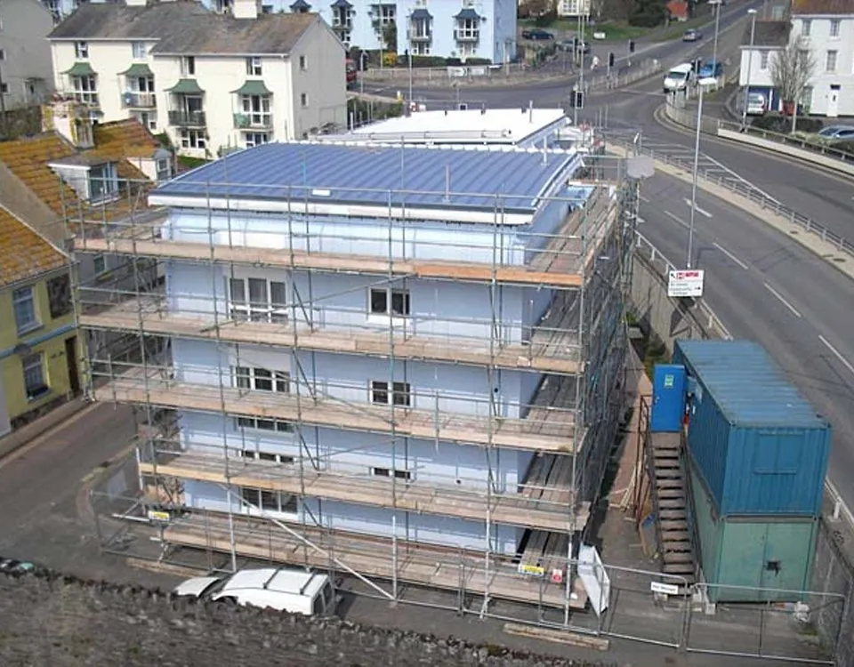 Scaffolding around a tall blue building
