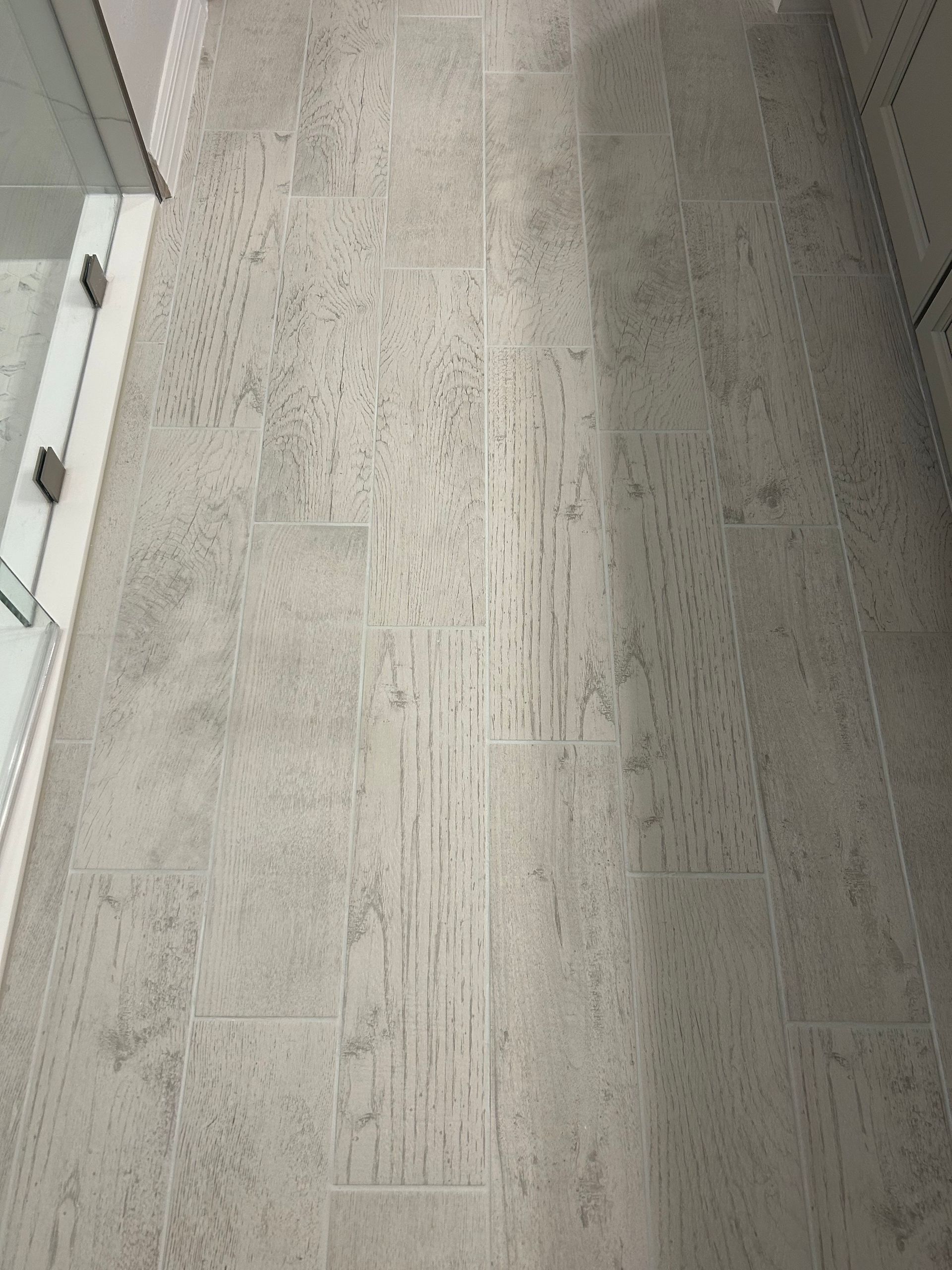 Gray textured bathroom floor.