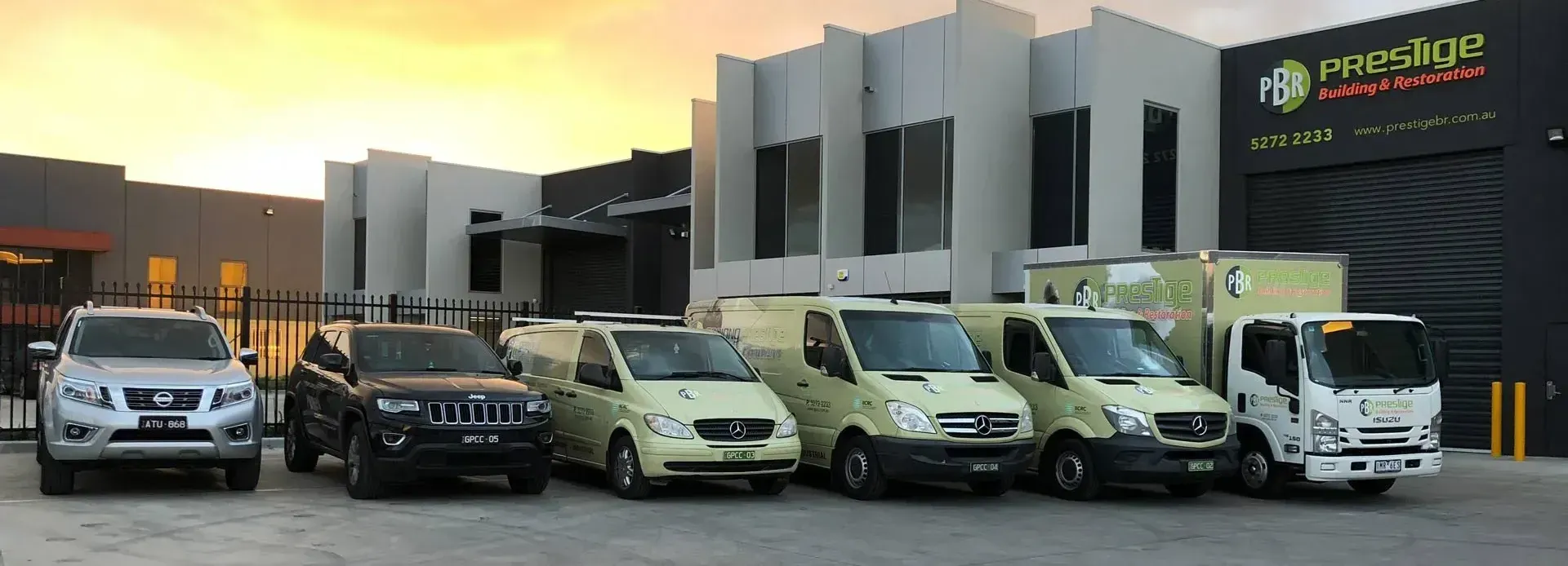 A man and a woman are cleaning a building.
